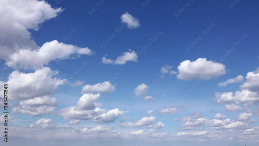 Timelapse shooting lots of white fluffy clouds floating i blue sky. Timelapse shooting lots of white fluffy clouds floating i blue sky.