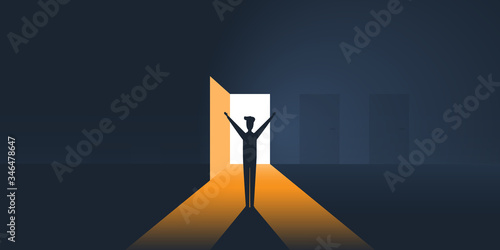 Happy Business Man in a Dark Room with Open Door, Light Coming Through - New Possibilities, Hope Concept, Overcome Problems, Solution Finding