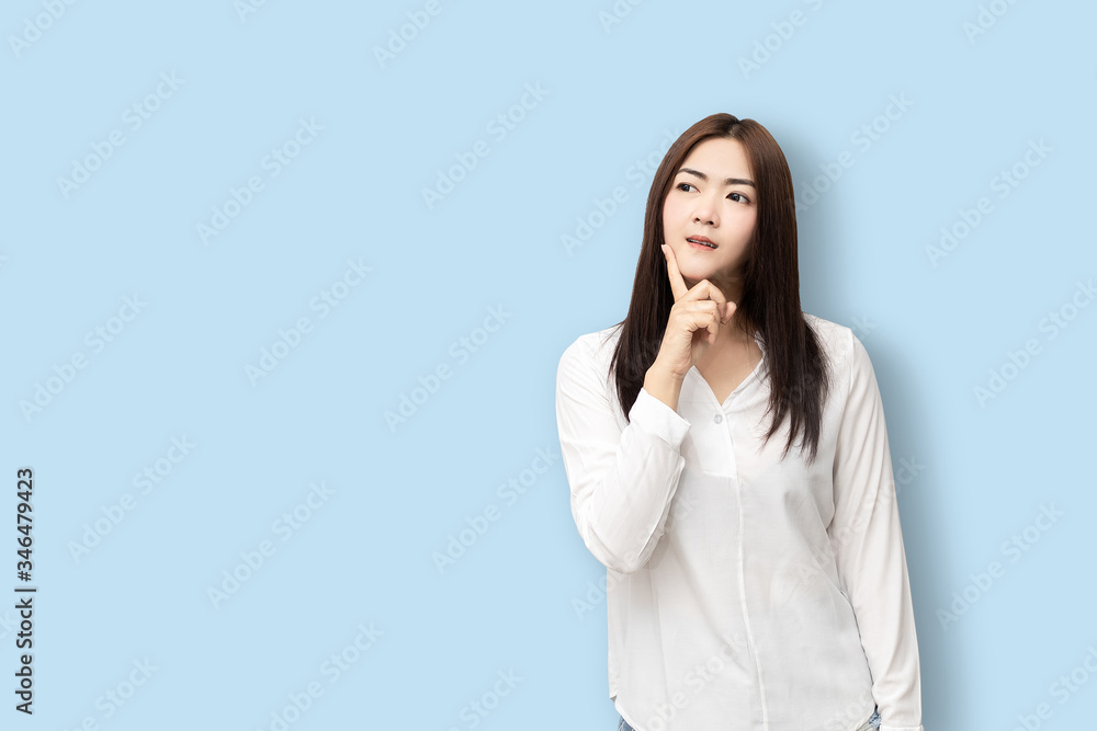 Long-haired Asian women are standing thinking. Long-haired Asian women are standing thinking.