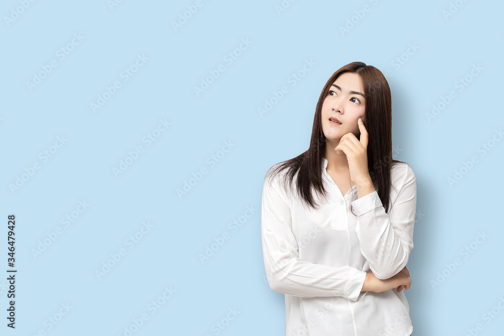 Long-haired Asian women are standing thinking. Long-haired Asian women are standing thinking.