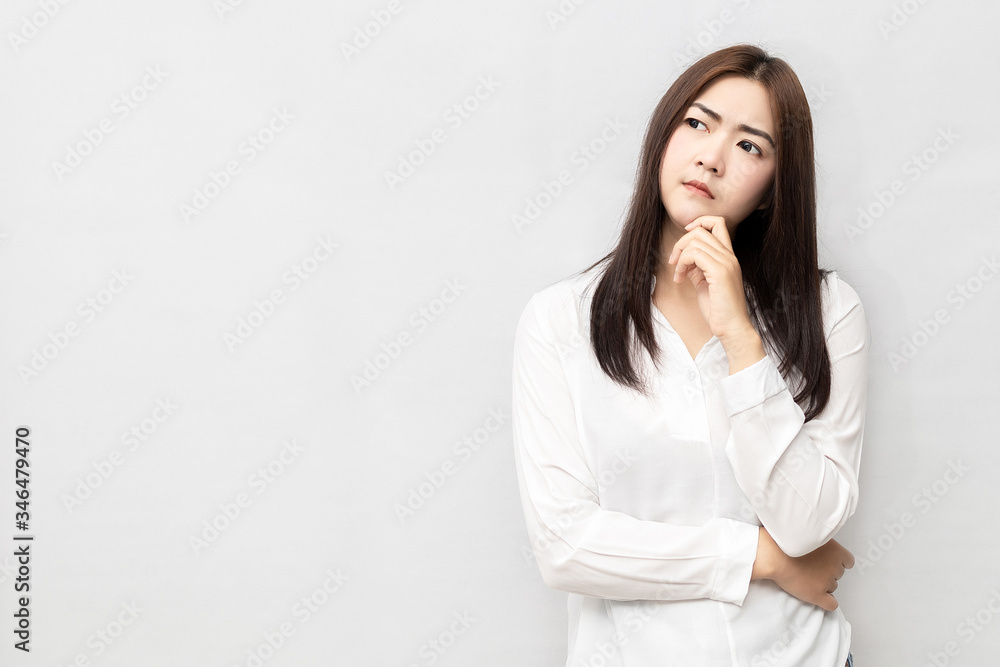 Long-haired Asian women are standing thinking Long-haired Asian women are standing thinking