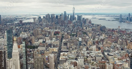 Panoramic shot over Manhattan, starting on Flatiron building and ending on World Trade Center, financial district of New York City and Hudson River.