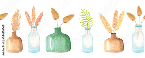 Hand-drawn watercolor seamless border with dried flowers in vases. Glass bottles with pampas grass and palm leaves isolated on white background.
