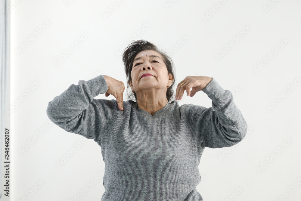 Asian senior woman doing exercise and dancing at home, stay home lifestyle concept. Asian senior woman doing exercise and dancing at home, stay home lifestyle concept.