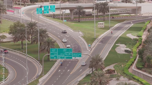 Aerial view of empty highway and interchange in Dubai after epidemic lockdown. Cityscapes with appearing traffic on streets. Roads and lanes crossroads without cars near JLT, Dubai, United Arab photo