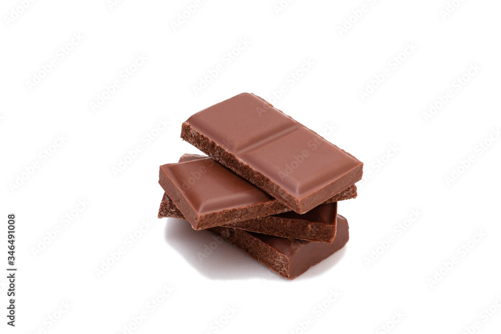 Pieces of chocolate on a white background, isolate. Broken chocolate bar Pieces of chocolate on a white background, isolate. Broken chocolate bar