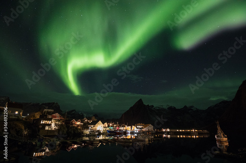 A small village in the arctic under the aurora. 
