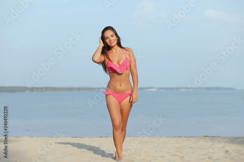 Beautiful girl in bikini on the beach © zhagunov_a
