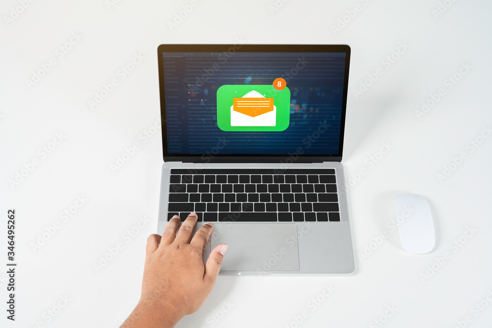 Person using a laptop computer with email communication connection message online and chat on social media with global letters concept. Laptop mockup with clipping path on screen. Person using a laptop computer with email communication connection message online and chat on social media with global letters concept. Laptop mockup with clipping path on screen.