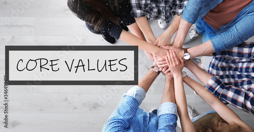 Core values concept. People holding hands together, top view
