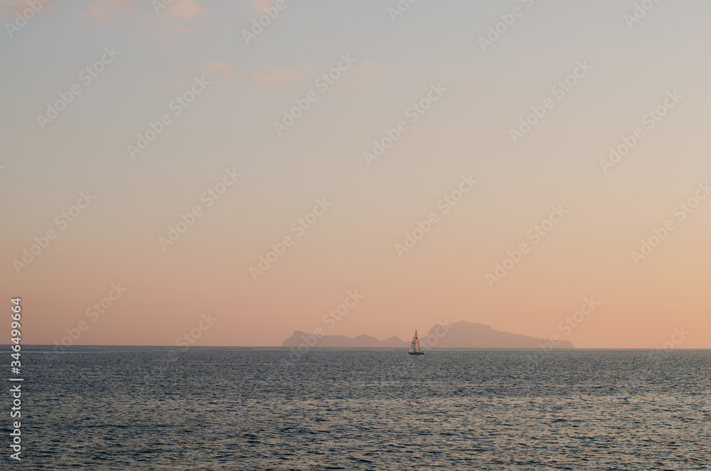 One ship in the sea at sunset. Orange sky. Beautiful landscape.