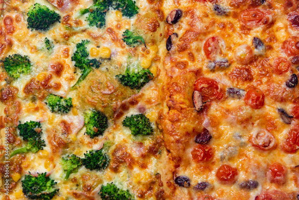 Close up fresh pizza with broccoli, beans, cheese, cherry tomatoes.