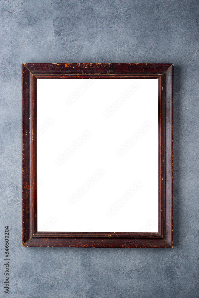 Old wooden picture frame on a gray background. Old wooden picture frame on a gray background.