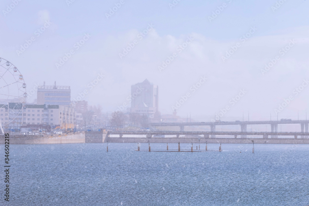 Cheboksary center and the water surface of the Bay in the spring of 2020 during a sudden snowstorm