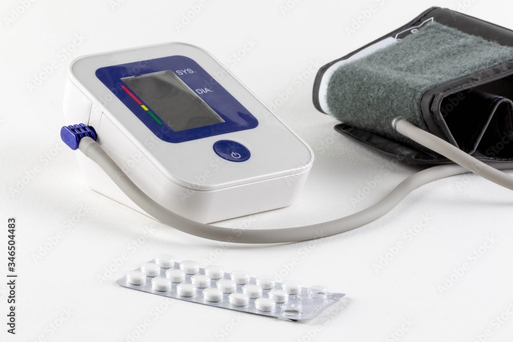 Check your blood pressure and heart rate with a digital pressure gauge for standard blood pressure readings. Health and medical concept. Check your blood pressure and heart rate with a digital pressure gauge for standard blood pressure readings. Health and medical concept.