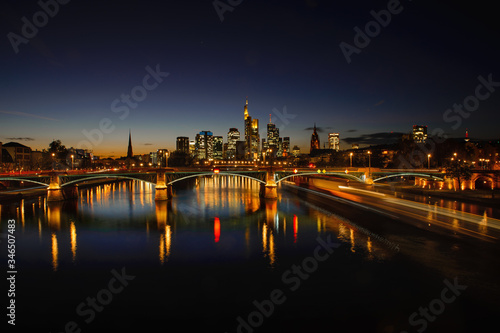 frankfurt at night and a ship with long exposure - panorama