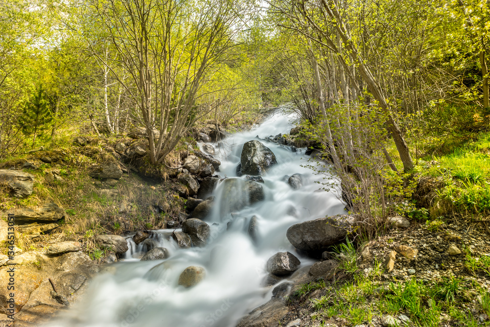 Waterfall in the Riu de la Bor in L Aldosa de Canillo in Andorra in spring.
