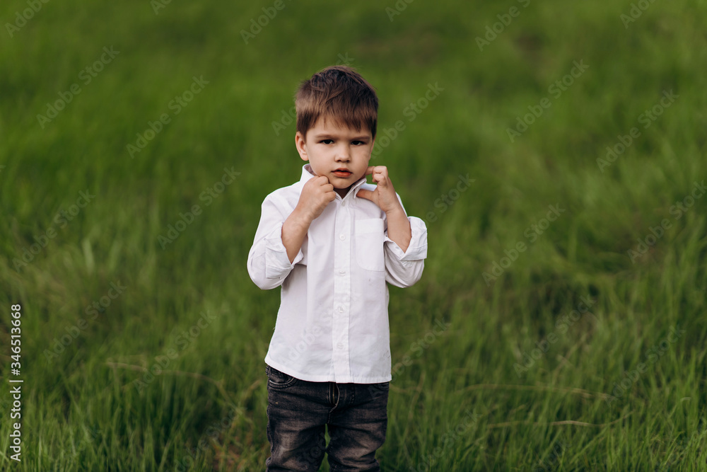child with a smile on the green hills, fields child with a smile on the green hills, fields
