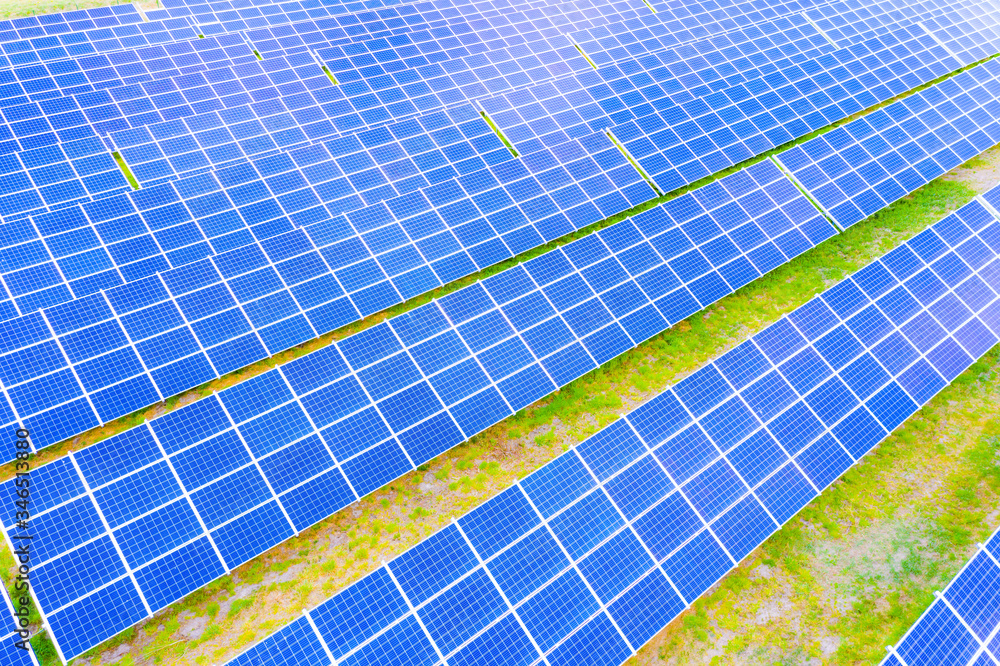 power solar panel on blue sky background,alternative clean green energy concept. Aerial view of Solar panels Photovoltaic systems industrial landscape power solar panel on blue sky background,alternative clean green energy concept. Aerial view of Solar panels Photovoltaic systems industrial landscape