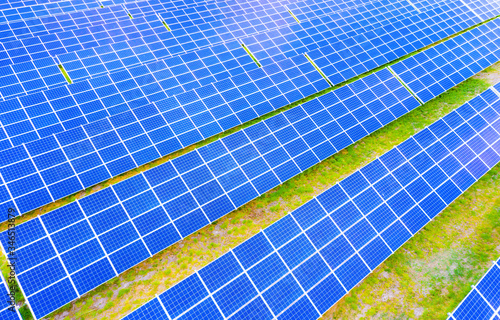 power solar panel on blue sky background alternative clean green energy concept. Aerial view of Solar panels Photovoltaic systems industrial landscape