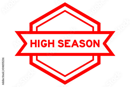 Hexagon vintage label banner in red color with word high season on white background