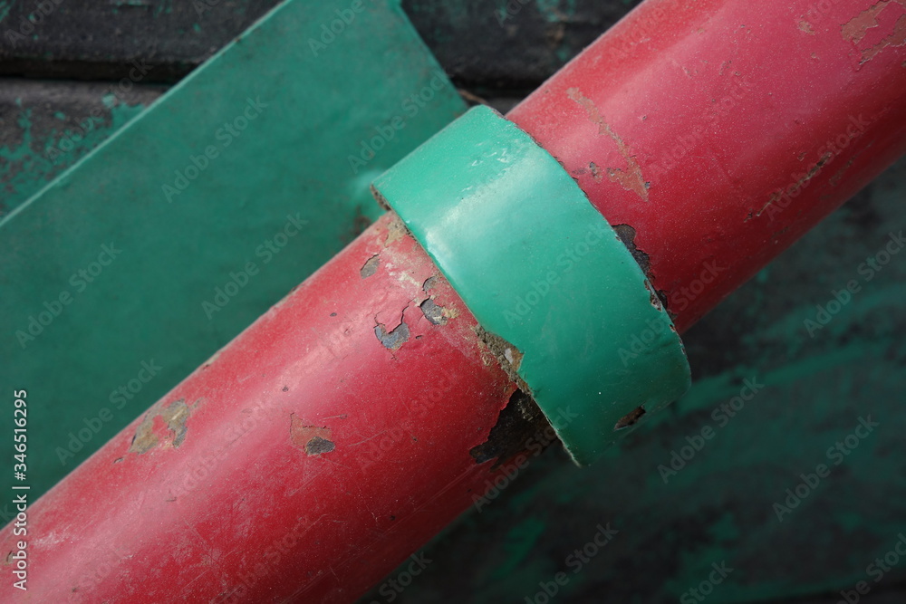 red and green coating on metal