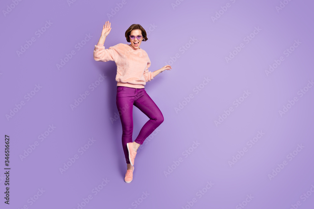 Full size photo of crazy funky girl dance enjoy loud music party event have free time feel carefree emotions wear good look soft clothes isolated over purple color background