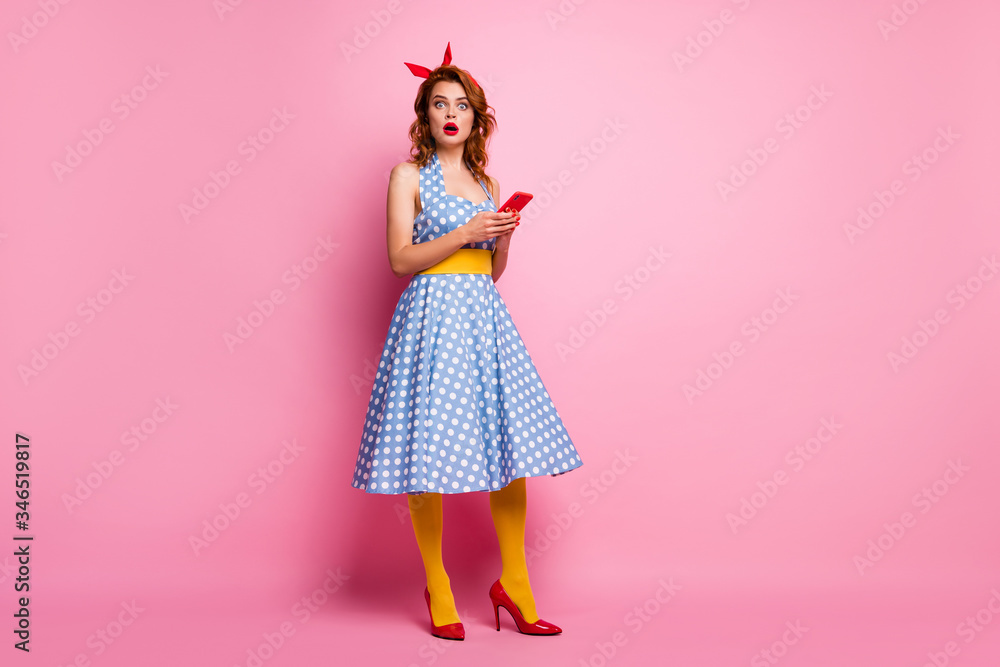 Full body profile photo of beautiful elegant lady hold telephone hands open mouth read bad news wear headband dotted dress high-heels stockings isolated pink color background