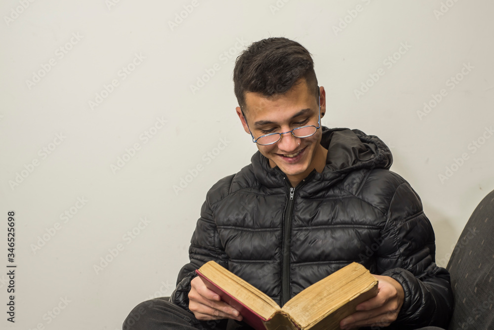 young man reading on the couch
young man reading on the couch