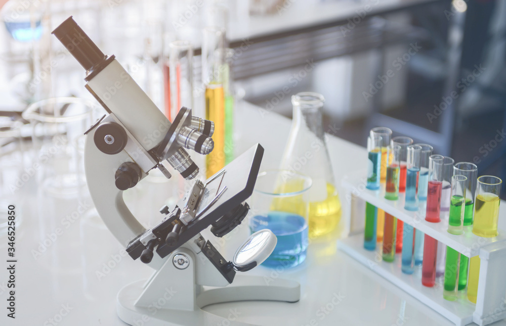 Close up of electron microscope and glass laboratory chemical with chemical compounds inside in chemical lap Close up of electron microscope and glass laboratory chemical with chemical compounds inside in chemical lap