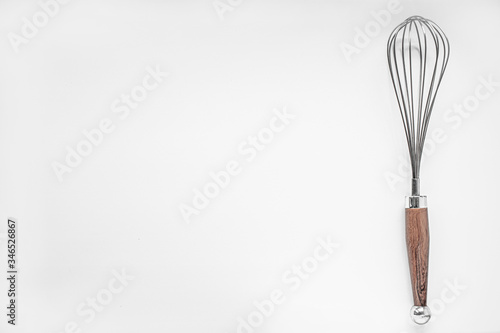 Kitchen whisk for whipping on a white background