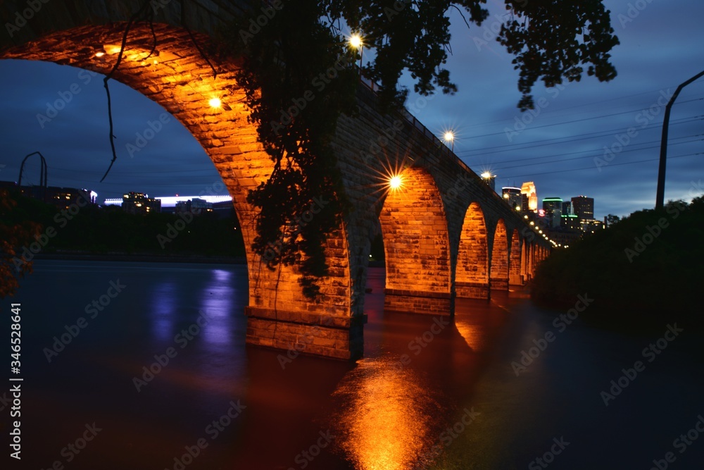 Arch Bridge Over River In City At Night Stock Photo | Adobe Stock
