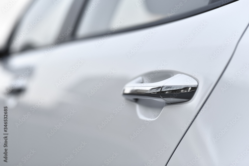handle of white business car in selective focus