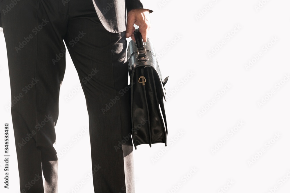 Cutouts of Businessman holding brief case bag Cutouts of Businessman holding brief case bag