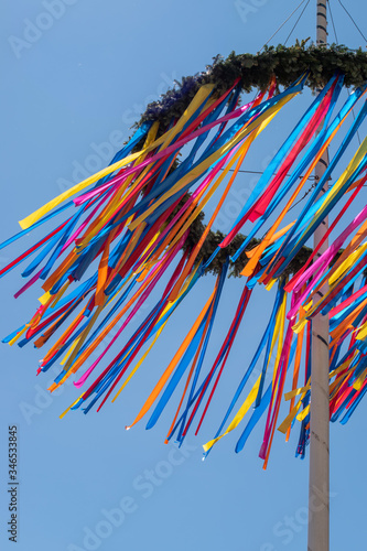 Photos colourful maypole blowing in the wind