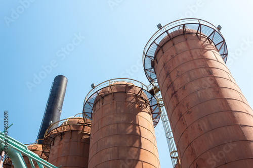 Sloss Furnaces National Historic Landmark, Birmingham Alabama USA, row of steel mill furnaces against a blue sky, copy space, horizontal aspect photo