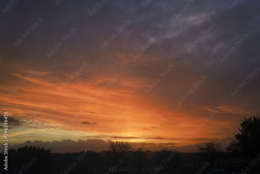 Solar Pillar under a Golden Cloudscape