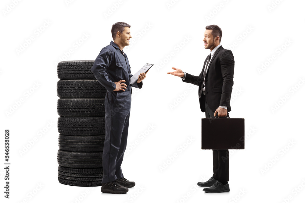 Auto mechanic talking with a businessman Auto mechanic talking with a businessman