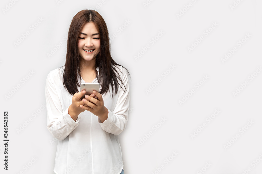 Asian women are reading good news on smart phones. Asian women are reading good news on smart phones.