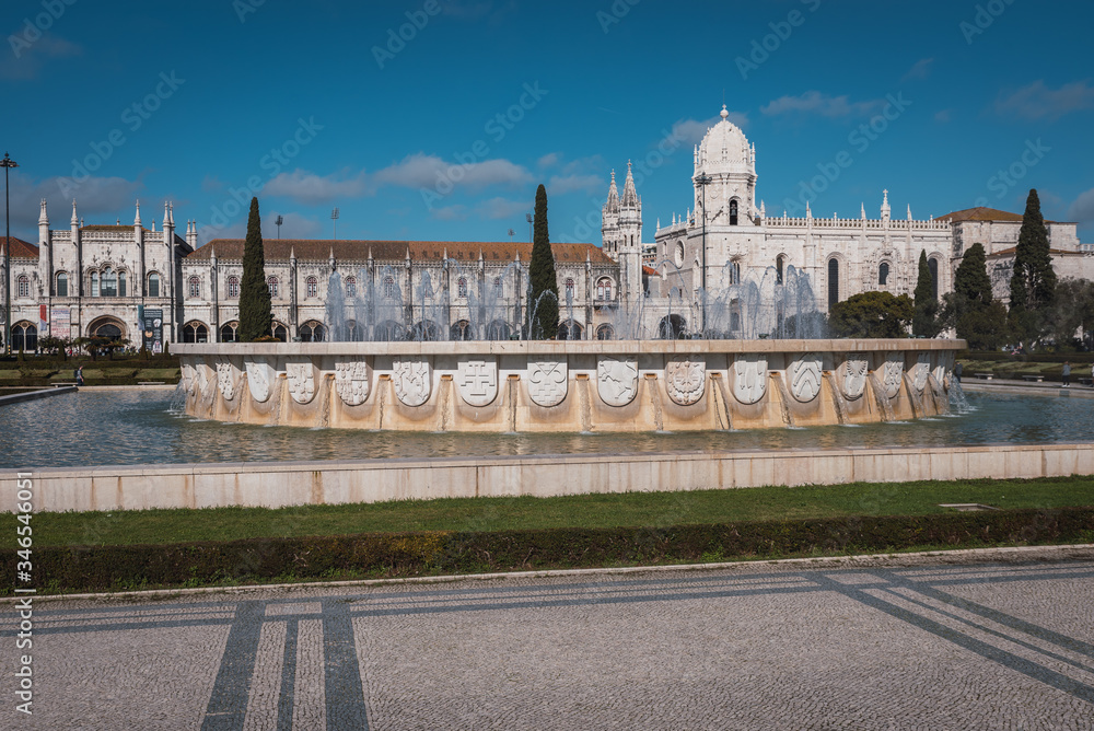 fountain with jeronimos monastery in the background in lisbon