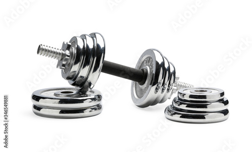 Wallpaper Mural Silver coloured shiny metal dumbbell standing at pile of disks Torontodigital.ca