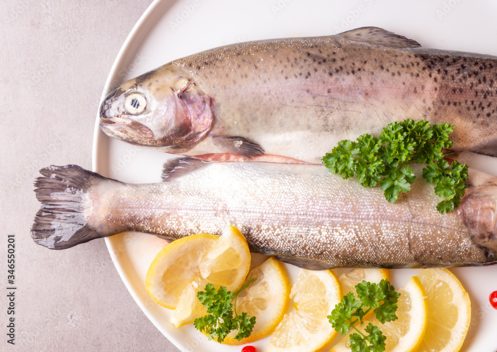 Fresh trout fish with lemon parsley cranberries Fresh trout fish with lemon parsley cranberries