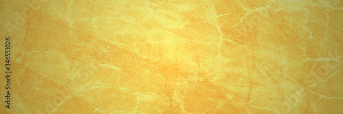 Yellow background with marble texture in old vintage paper design