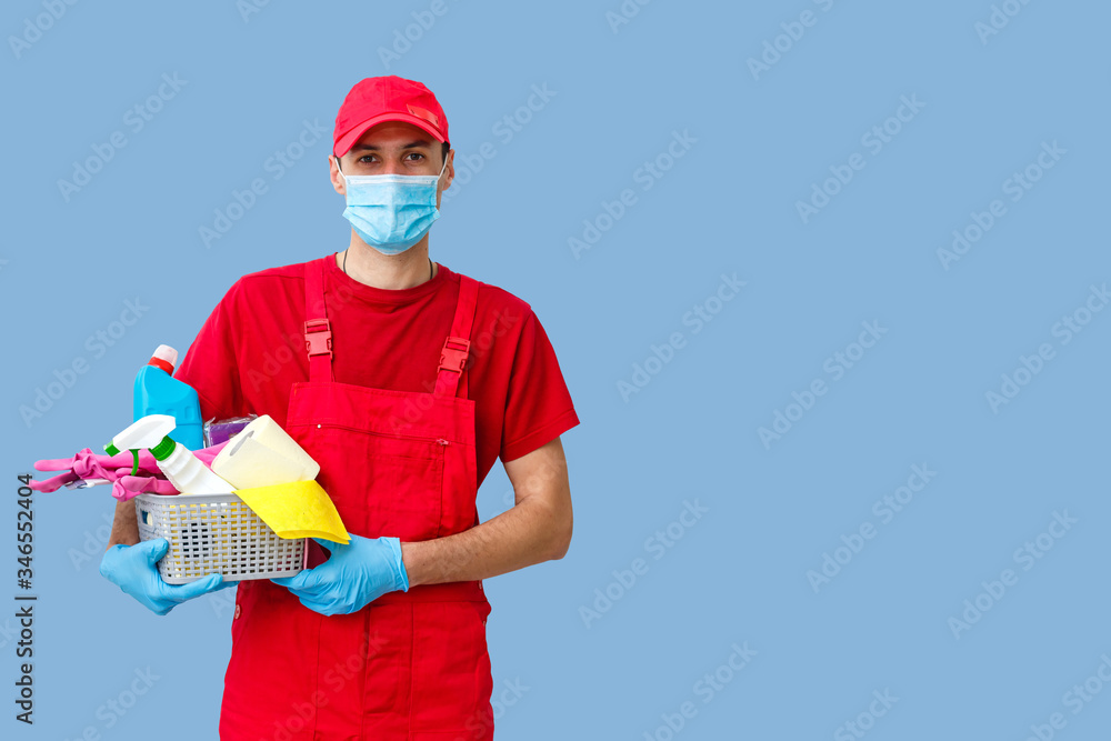 Cleaning man with a bucket and cleaning products on color background. Cleaning man with a bucket and cleaning products on color background.