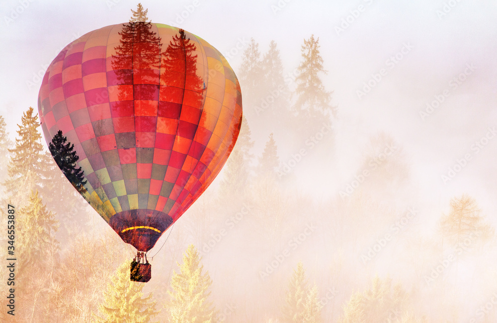 Obraz premium double exposure of hot air balloon and foggy forest freedom and nature concept
