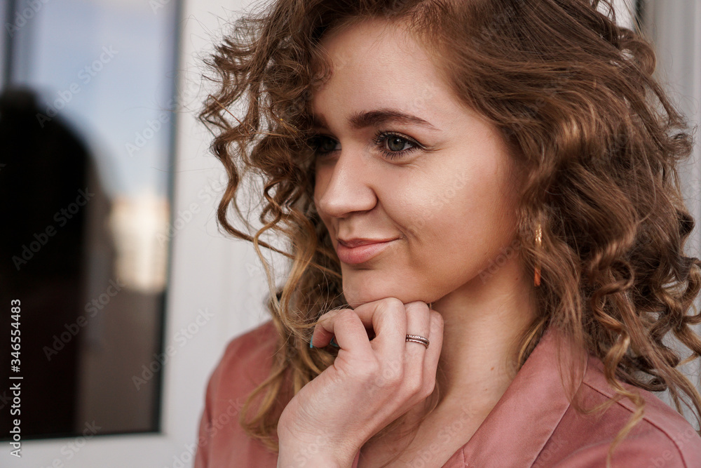 Portrait Of A Pretty Happy Woman with curly hair Portrait Of A Pretty Happy Woman with curly hair