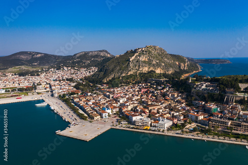Nafplio or Nafplion, Greece, Peloponnese old town houses aerial panorama with sea and snow mountain peaks