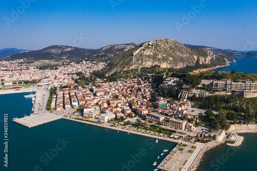 Nafplio or Nafplion, Greece, Peloponnese old town houses aerial panorama with sea and snow mountain peaks