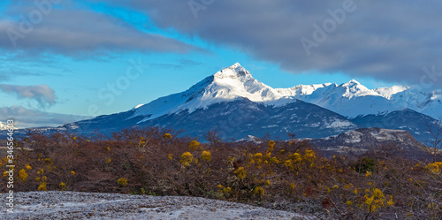 Panorama landscape with an illuminated peak of the Torres del Paine massif at sunrise in winter, Torres del Paine national park, Patagonia, Chile.