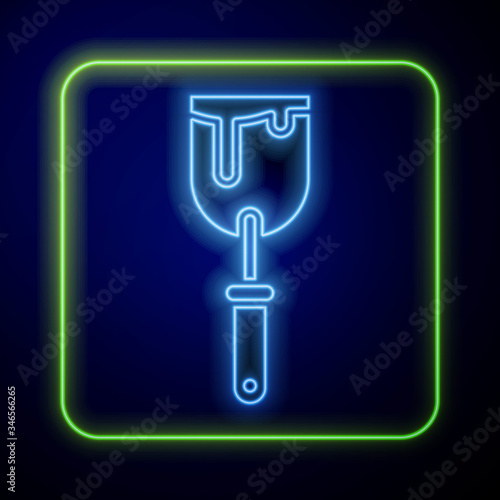 Glowing neon Putty knife icon isolated on blue background. Spatula repair tool. Spackling or paint instruments.  Vector Illustration